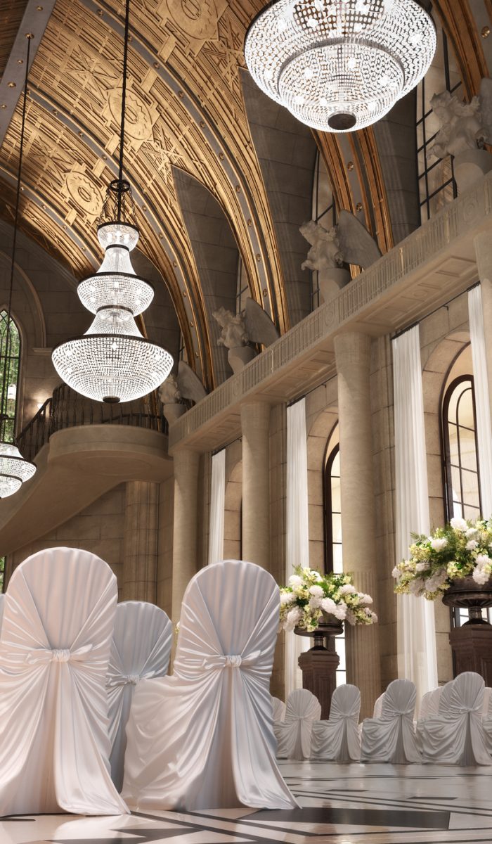 Church Cathedral wedding interior with rows of elegant chairs and flowing flower arrangements.